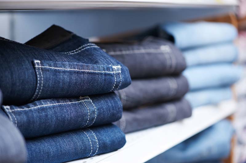 photodune-1304881-jeans-clothes-on-shelf-in-shop-m